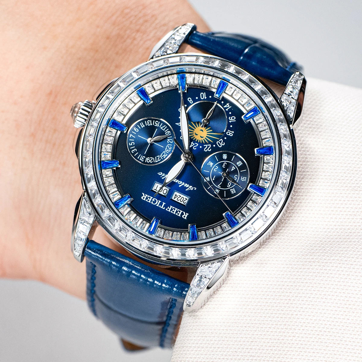 automatic moonphase  watch by reef tiger diamonds bezel, blue dial