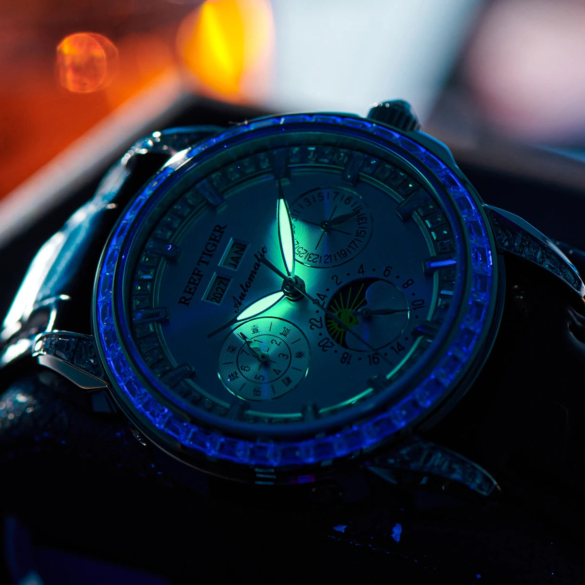 automatic moonphase  watch by reef tiger diamonds bezel, blue dial