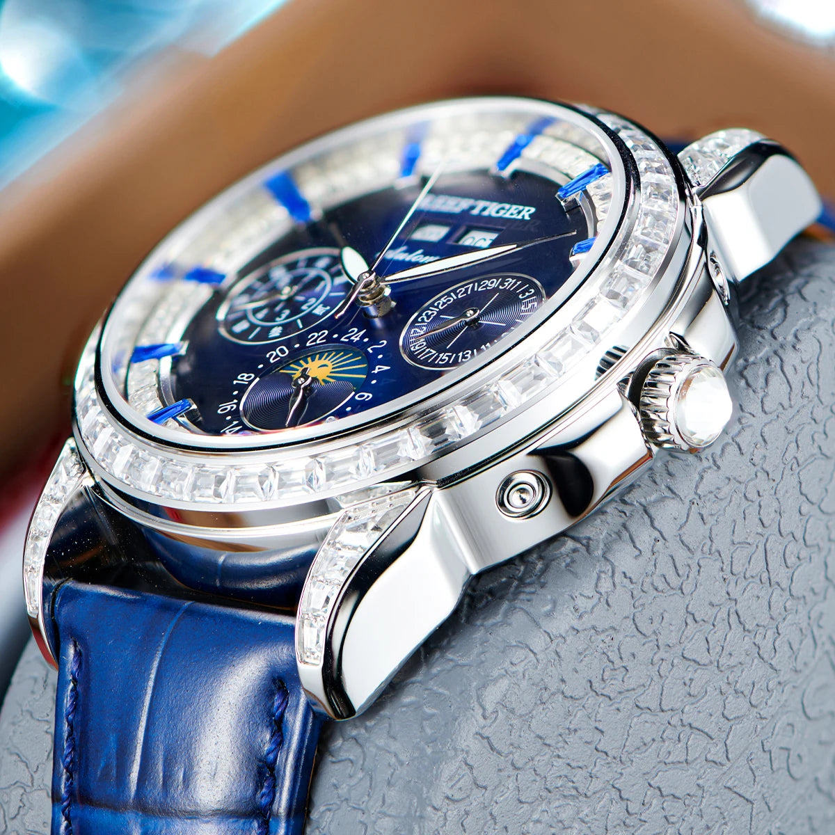 automatic moonphase  watch by reef tiger diamonds bezel, blue dial